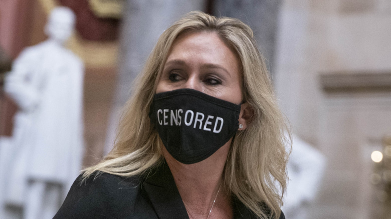 Marjorie Taylor Greene wearing a 'Censored' mask