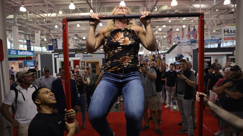 Marjorie Taylor Greene doing a chin-up at an event