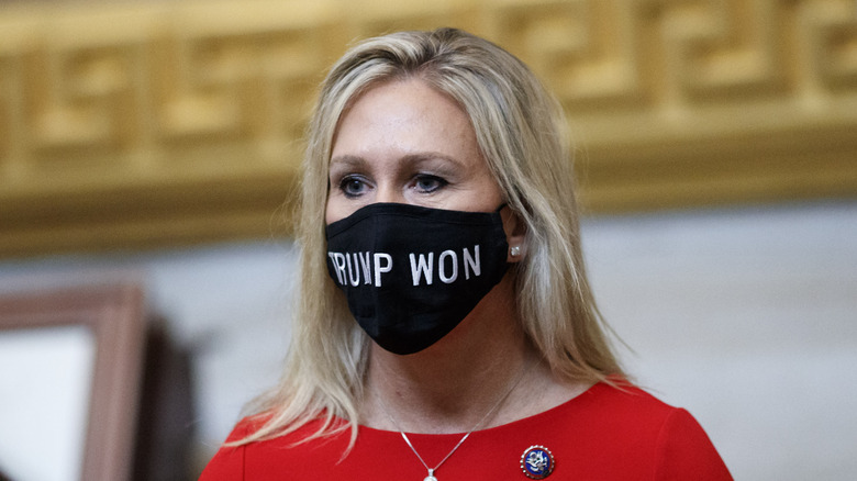 Marjorie Taylor Greene wearing a 'Trump Won' mask