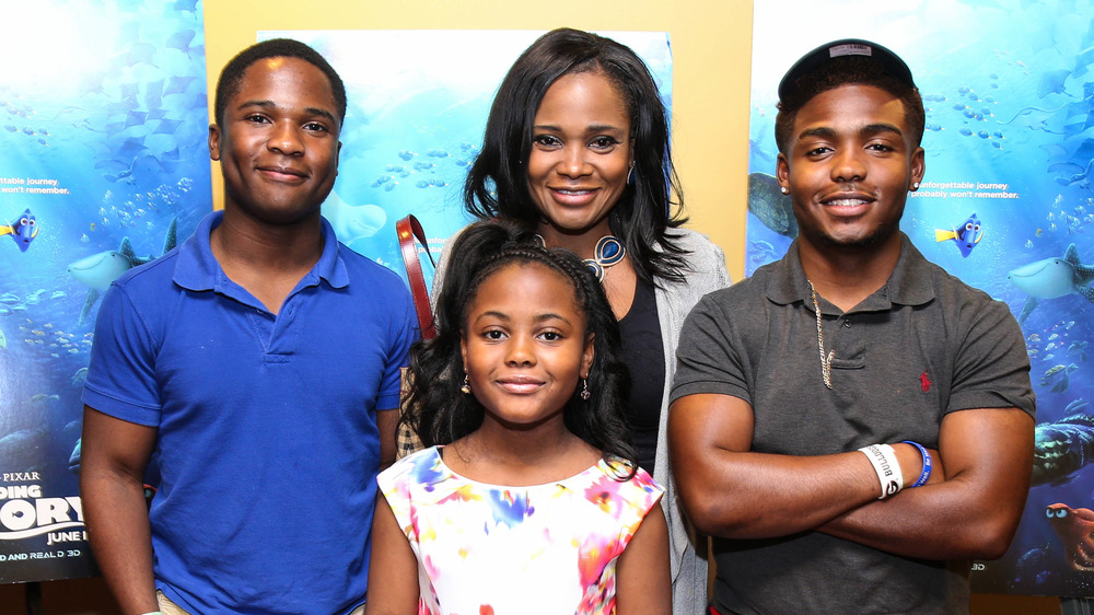 Dr. Heavenly Kimes smiling with her three children