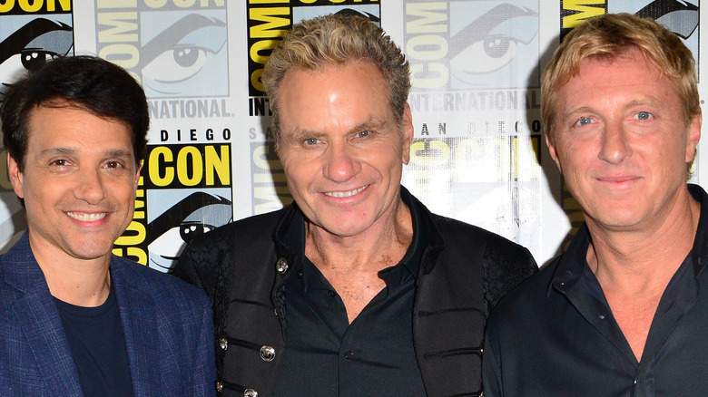 Ralph Maccio, Martin Kove, and William Zabka smiling