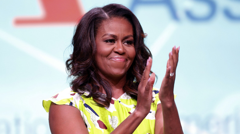 Michelle Obama clapping