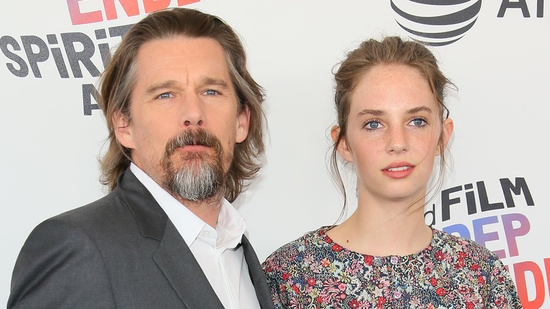 Ethan Hawke posing with Maya Hawke on the red carptet