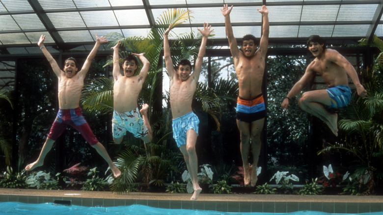 Menudo jumping into a pool