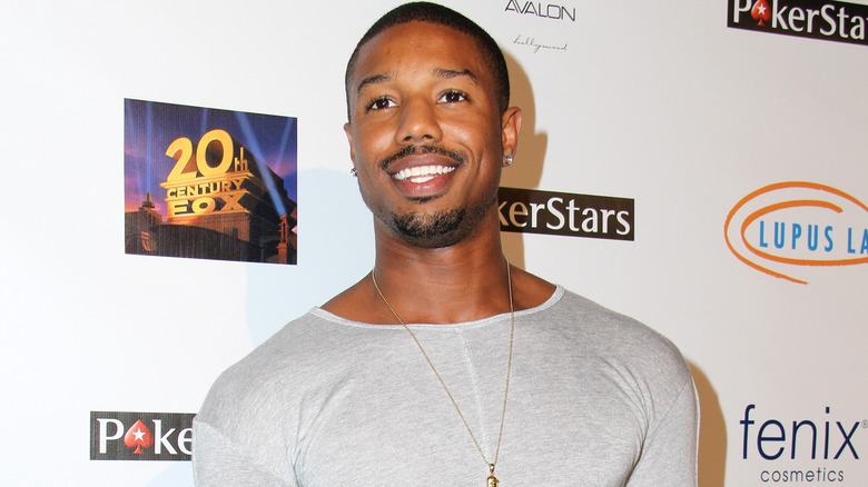 Michael B. Jordan smiling at a lupus fundraiser in 2014