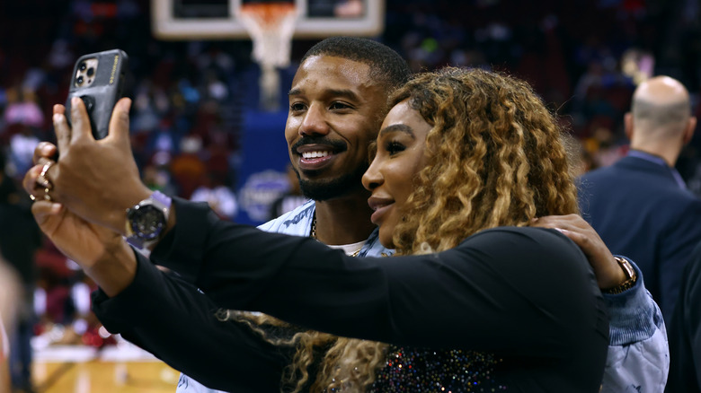 Michael B. Jordan taking a selfie with Serena Williams