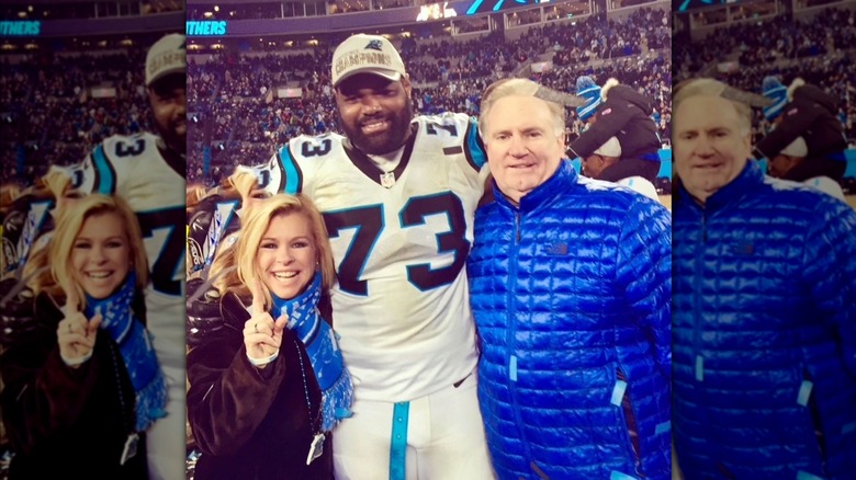 Leigh Anne Tuohy, Michael Oher, and Sean Tuohy posing