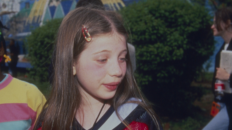 Michelle Trachtenberg as a child with barrette in her hair