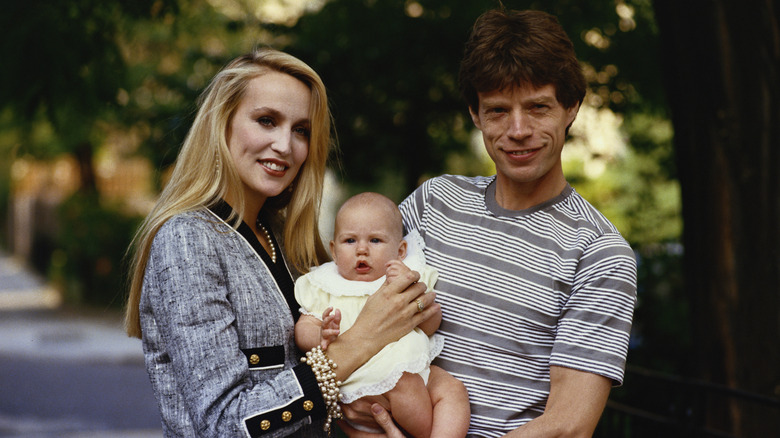 Mick Jagger, Jerry Hall, and one of their children