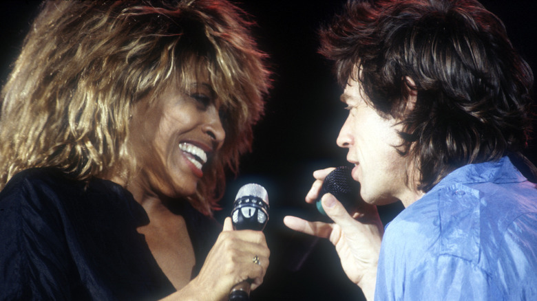 Mick Jagger and Tina Turner, performing on stage