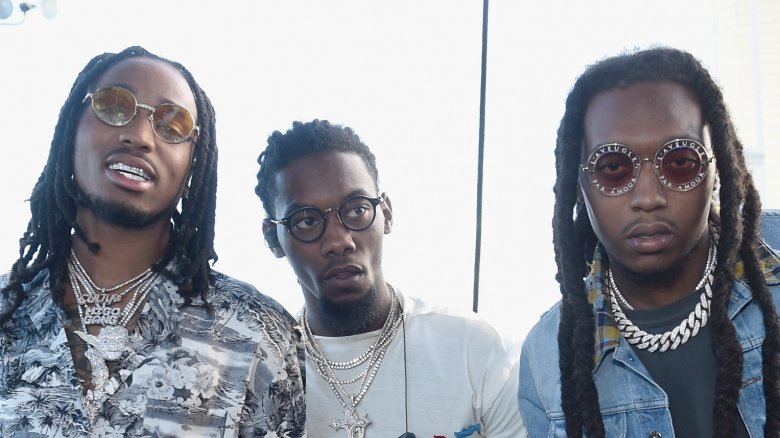 Migos posing at event