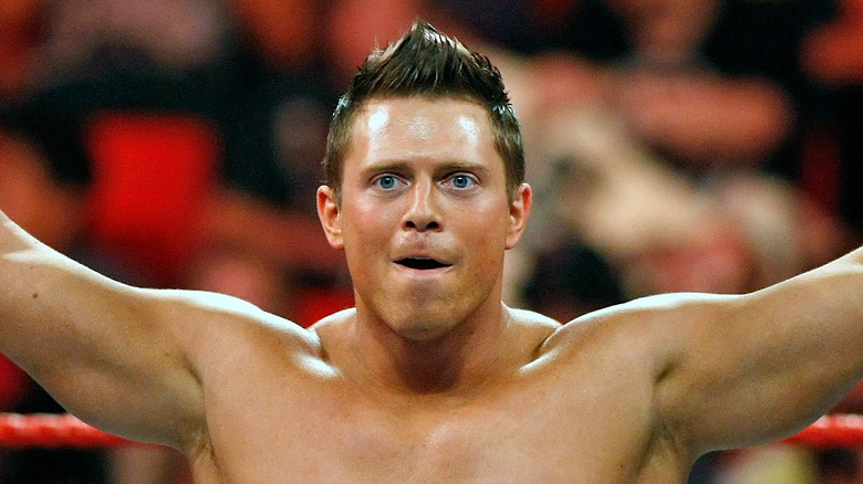 Mike Mizanin holds his arms up