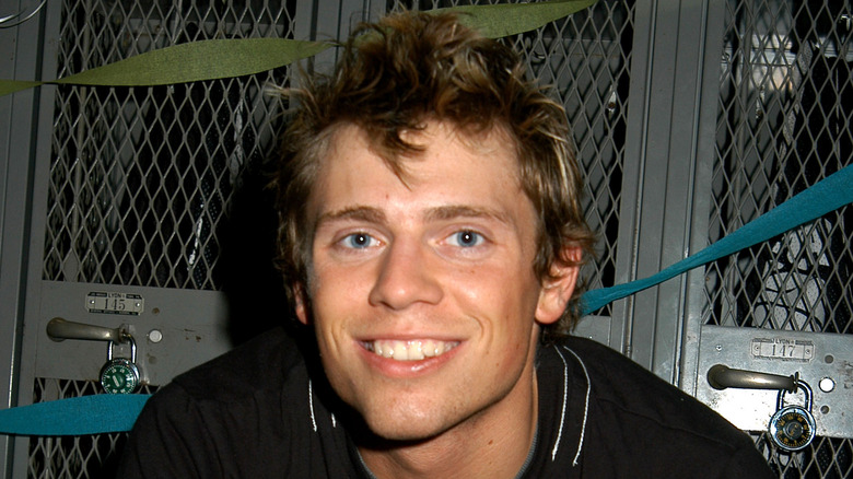 Mike Mizanin in front of lockers