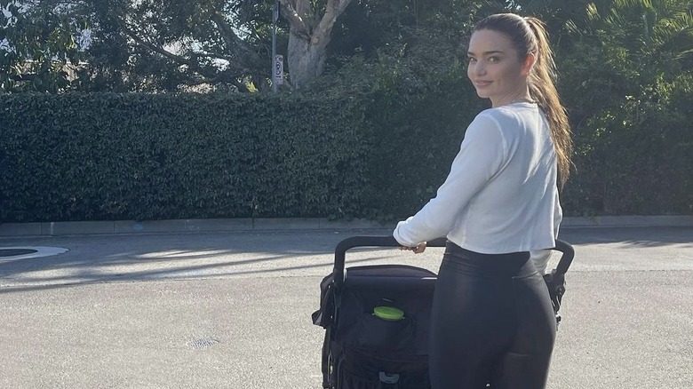 Miranda Kerr pushing a stroller