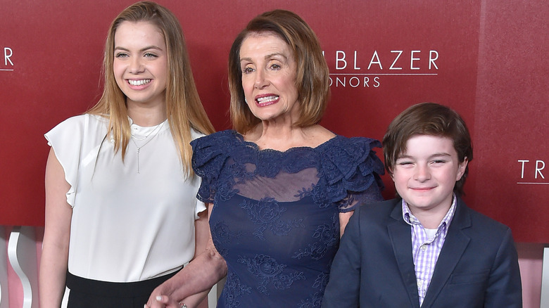 Nancy Pelosi with grandchildren, all smiling