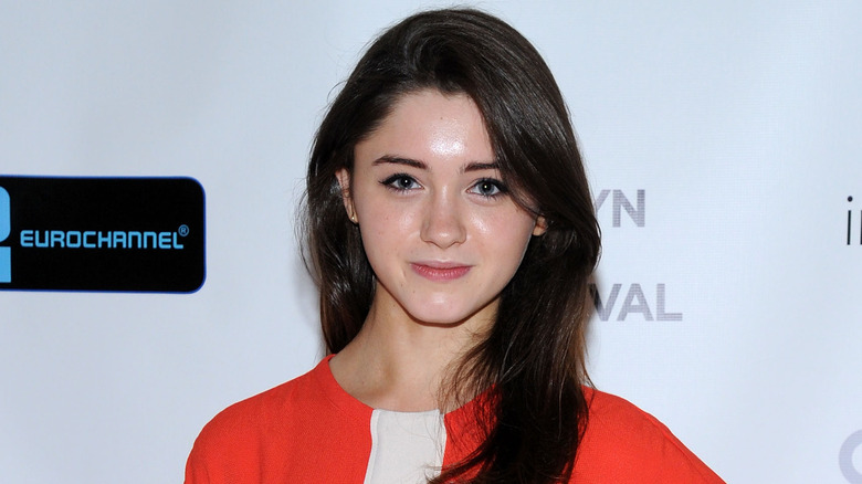 Natalia Dyer posing on red carpet