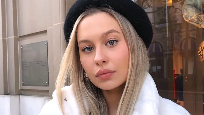 Natasha Bure posing while wearing beret