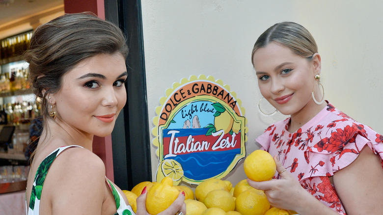 Olivia Jade Giannulli and Natasha Bure, holding lemons