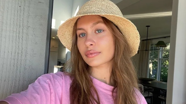 Natasha Bure wearing straw hat in selfie