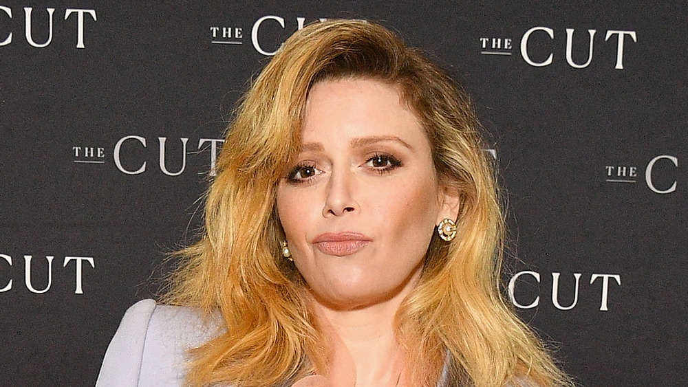 Natasha Lyonne smirking