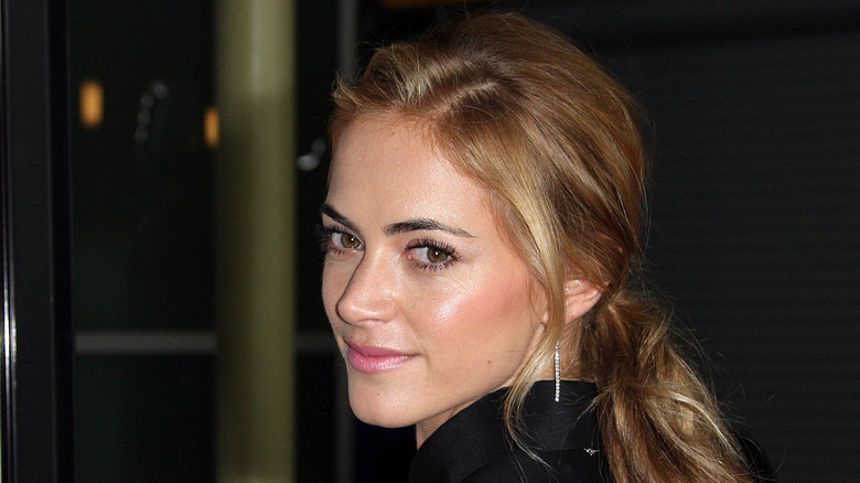 Emily Wickersham looking over her shoulder