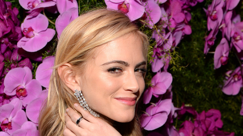 Emily Wickersham and purple flowers