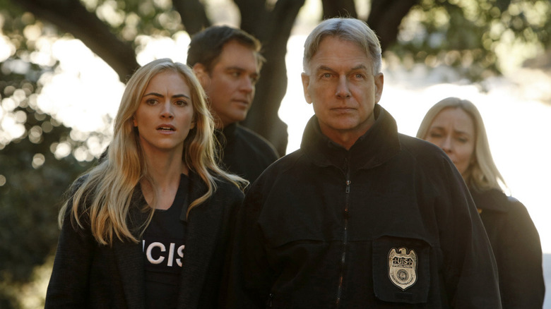 Emily Wickersham and Mark Harmon on set