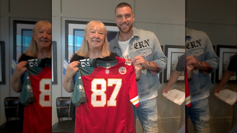 Donna Kelce, Travis Kelce posing with jersey