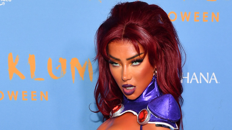 Nikita Dragun posing in costume at a Halloween event