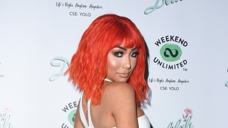 Nikita Dragun posing at an event