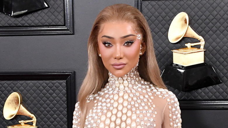 Nikita Dragun posing on the Grammy red carpet