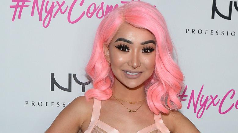 Nikita Dragun posing at an event