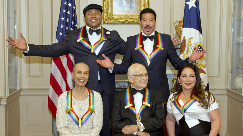 LL Cool J, Lionel Richie, Gloria Estefan, Norman Lear, and Carmen de Lavallade posing together as Kennedy Center honorees