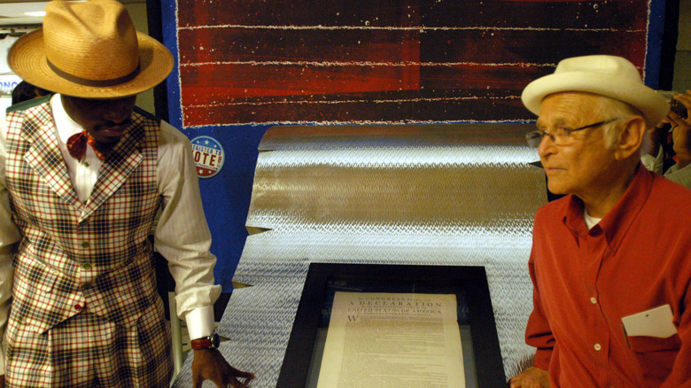 Andre 3000 and Norman Lear displaying the Declaration of Independence