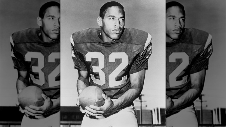 O.J. Simpson at USC holds football