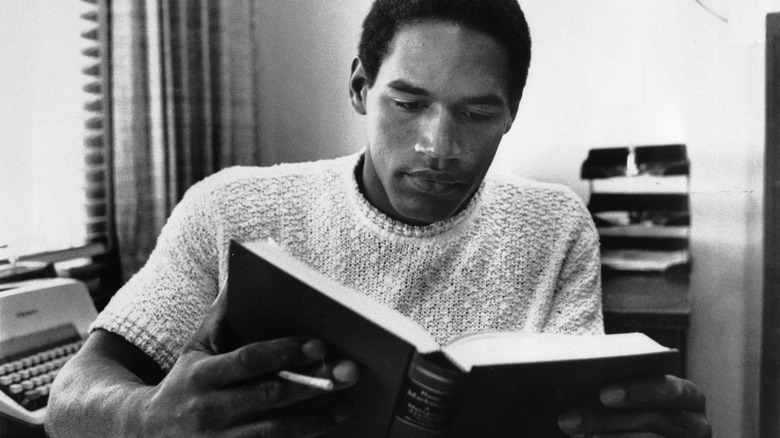 O.J. Simpson reads a book at USC