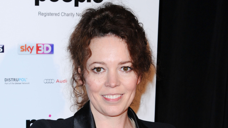 Olivia Colman posing in a black jacket