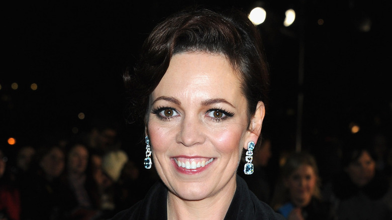 Olivia Colman smiling in front of a crowd