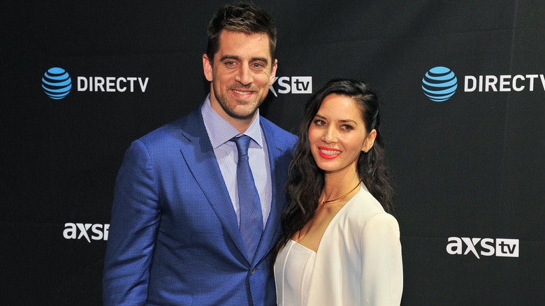 Aaron Rodgers, Olivia Munn, smiling together