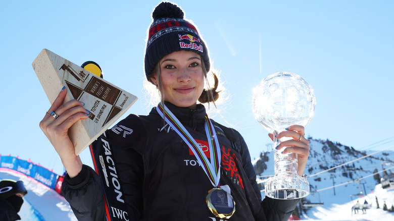 Eileen Gu posing with awards