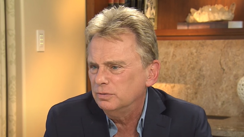 Pat Sajak looking serious during an interview