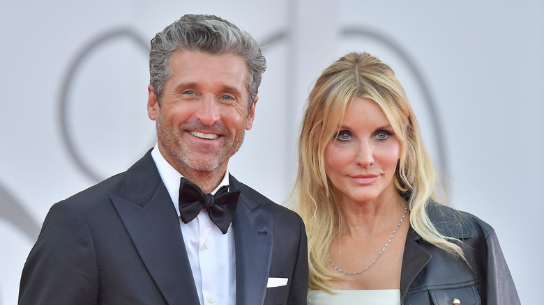 Patrick and Jillian Dempsey posing on a red carpet