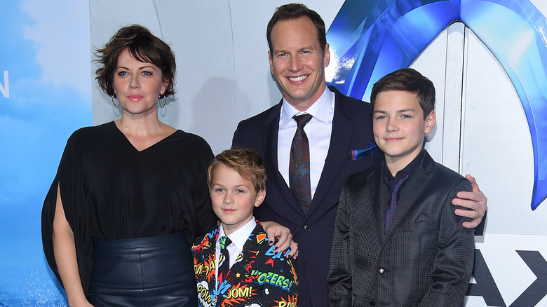 Patrick Wilson posing with his wife and kids