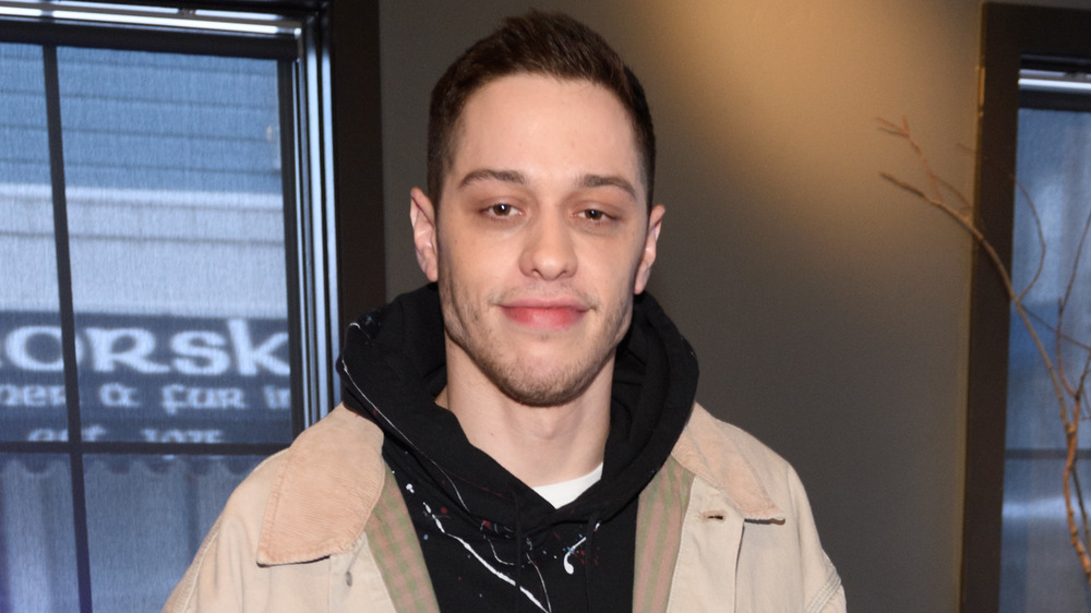 Pete Davidson smirking 