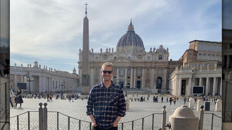 Peter Doocy posing in front of St. Peter's Basilica