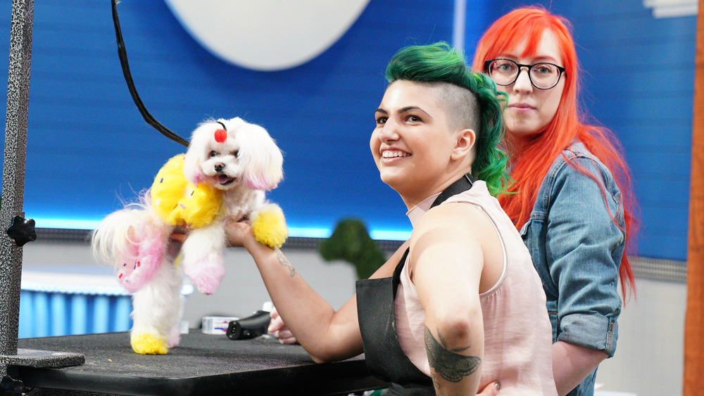 Pooch Perfect groomers posing with dog