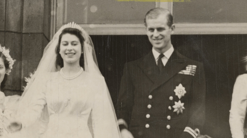 Queen Elizabeth II and Prince Philip smiling at their wedding 