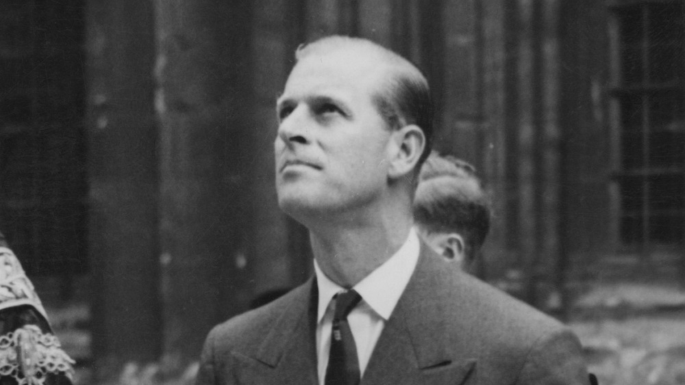 A young Prince Philip looking up to the sky 