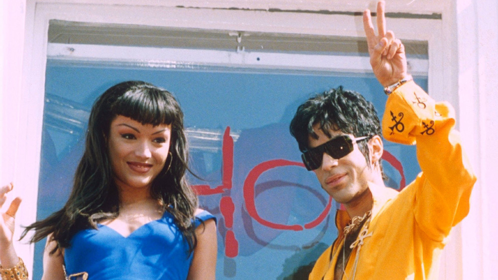 Prince and Mayte Garcia waving