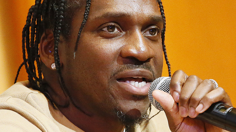 Pusha T talking into a microphone